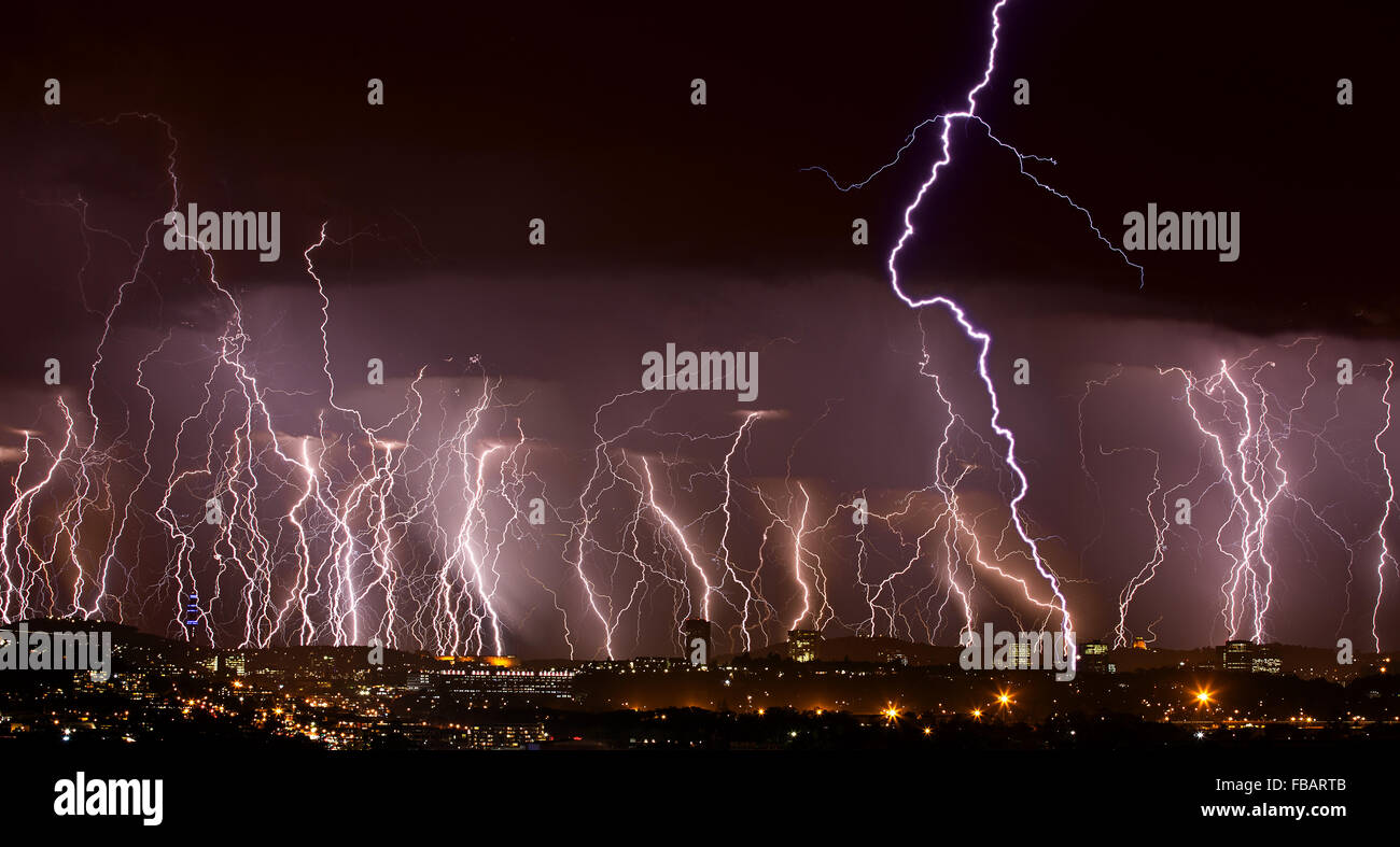 lightning over city Stock Photo - Alamy