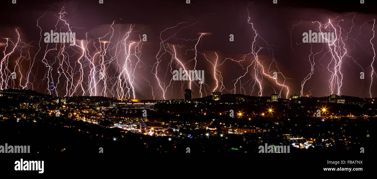 lightning over city Stock Photo - Alamy