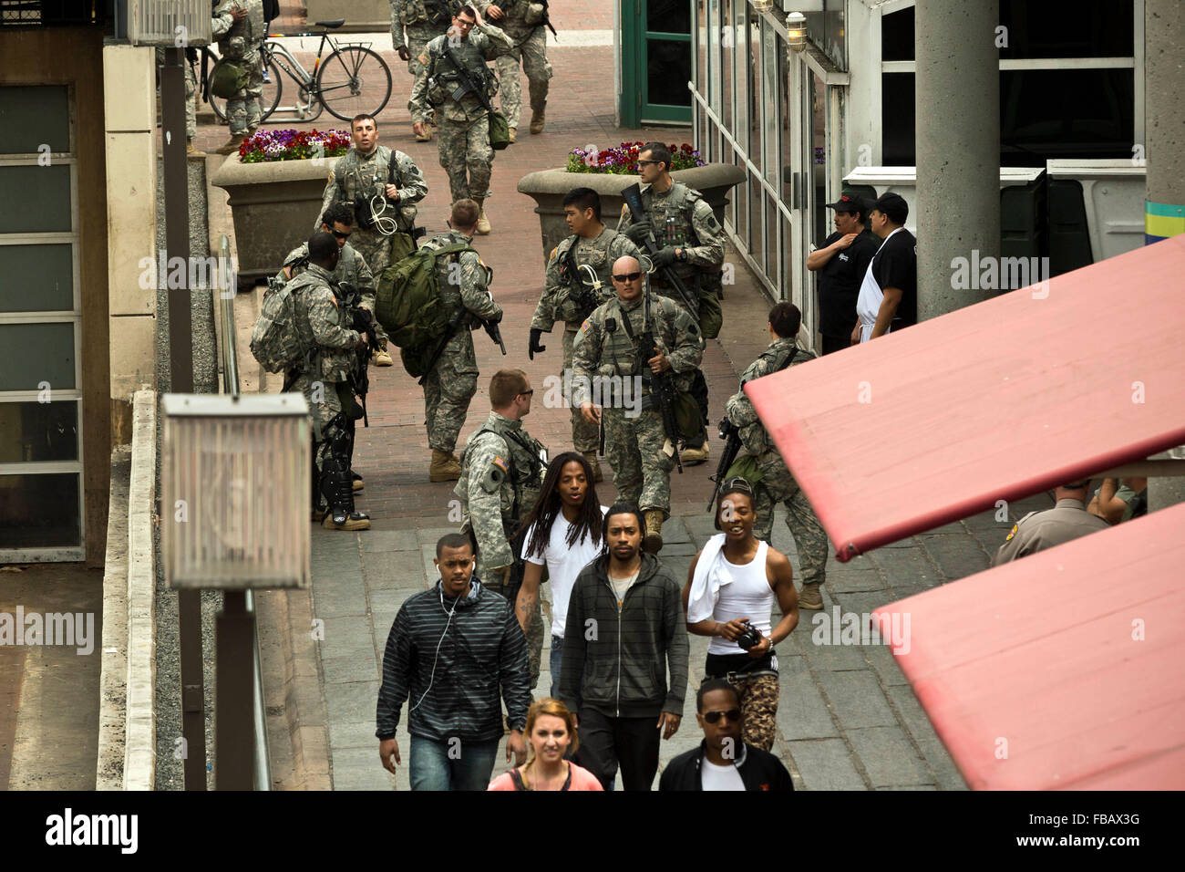 Heavily armed National Guard troopers patrol in Baltimores' inner harbor, April 30, 2015.   photo: Trevor Collens Stock Photo