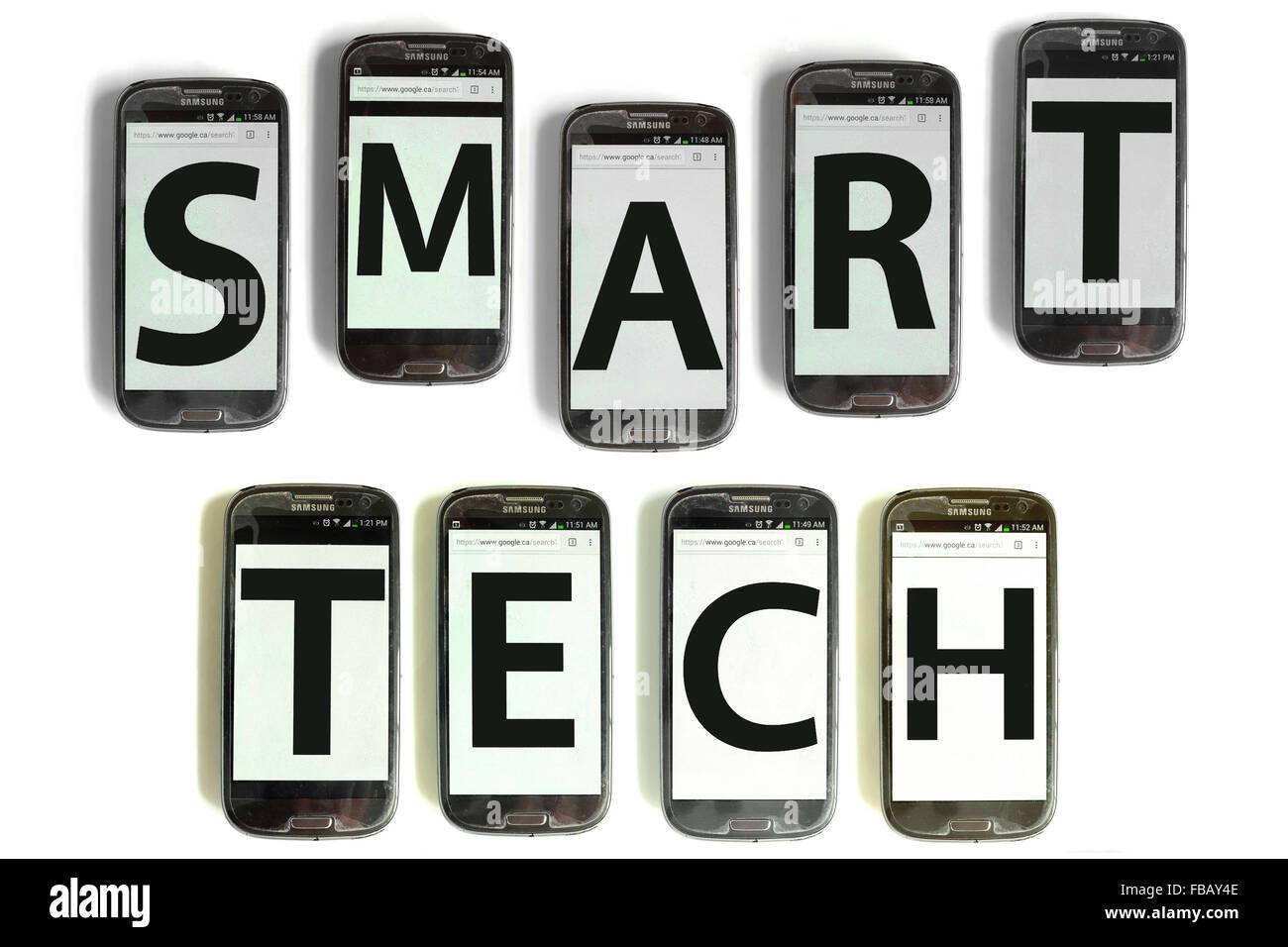 Smart Tech spelled out on mobile phone screens photographed against a white background. Stock Photo