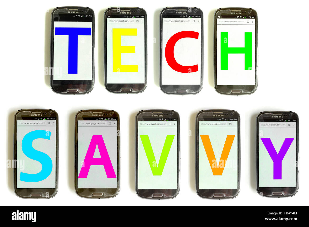 Tech Savvy spelled out on mobile phone screens photographed against a white background. Stock Photo