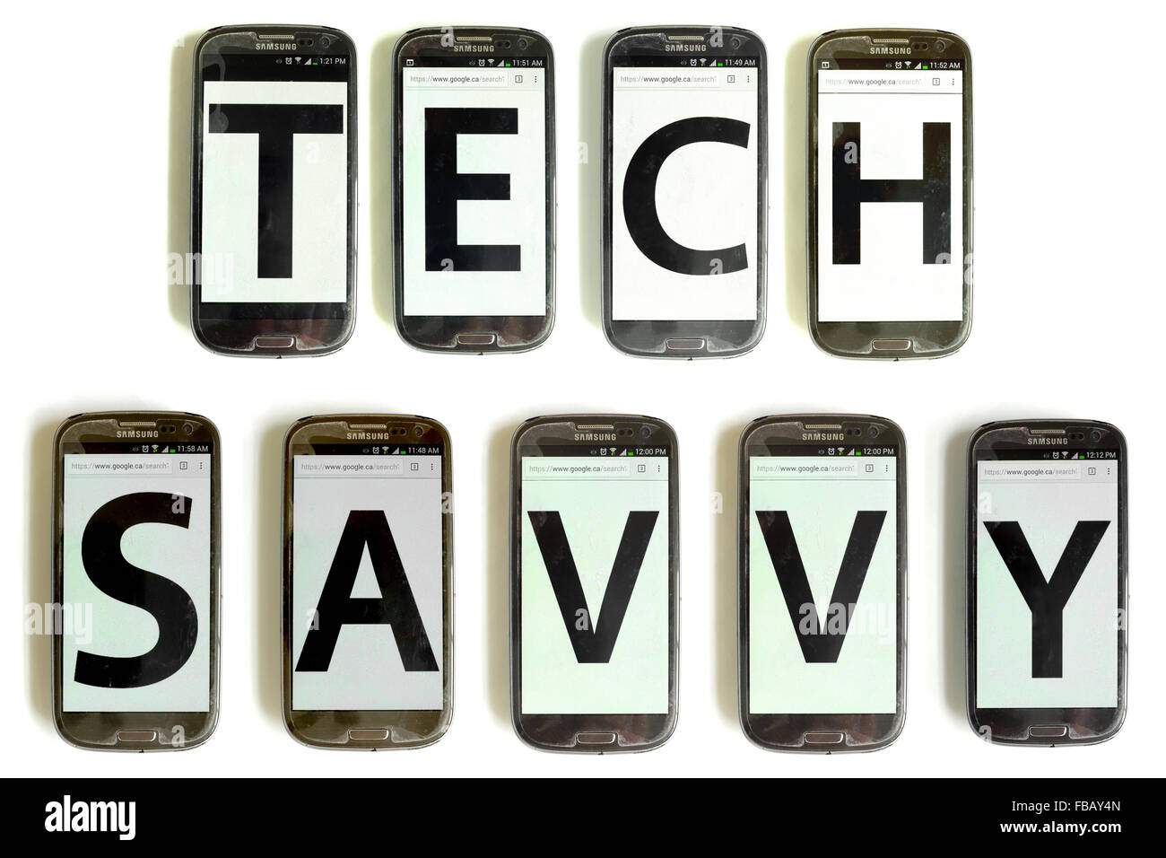 Tech Savvy spelled out on mobile phone screens photographed against a white background. Stock Photo