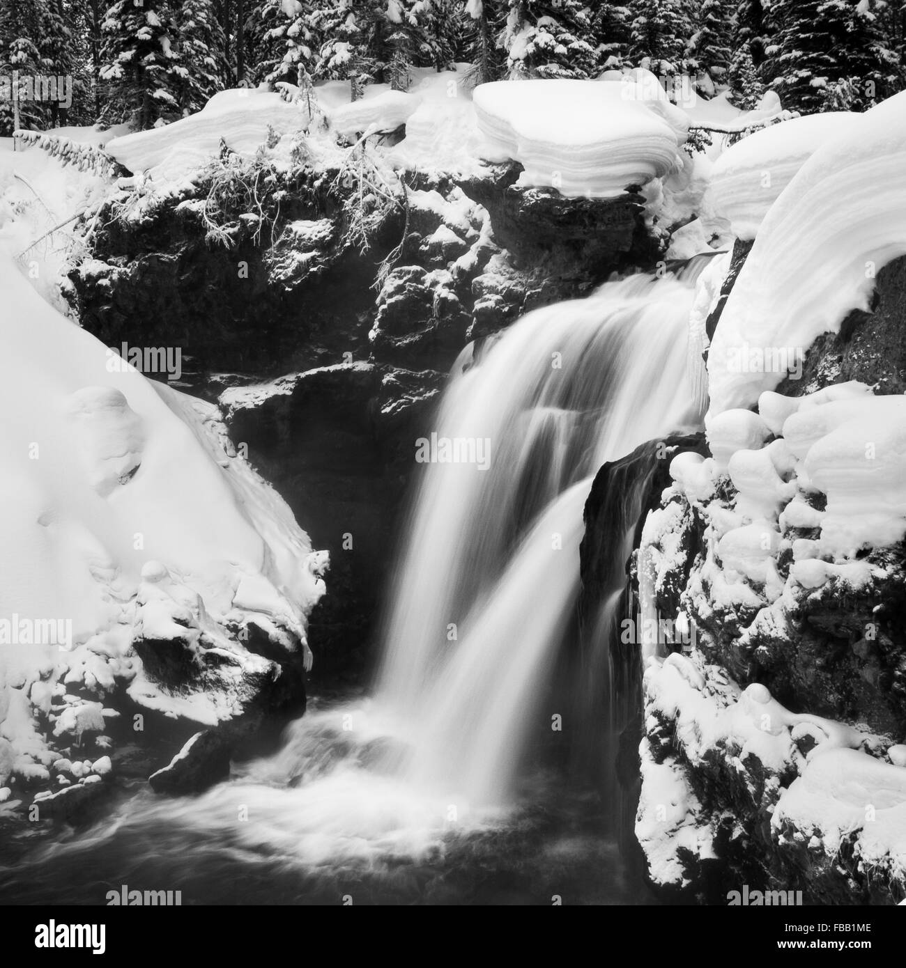 Winter surrounds Moose Falls in Yellowstone National Park, Wyoming. Stock Photo