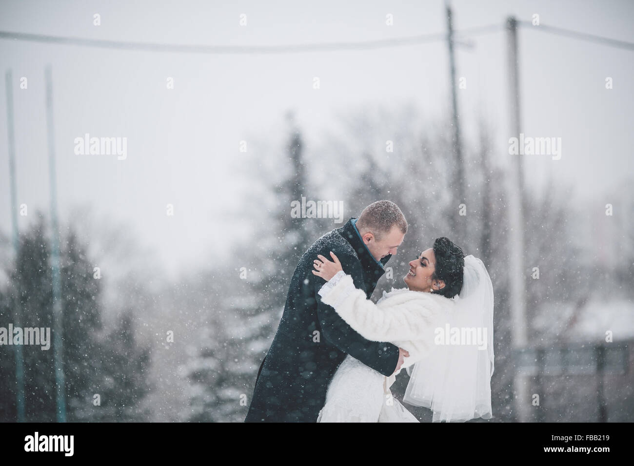 Bride and groom walking in the city Stock Photo - Alamy