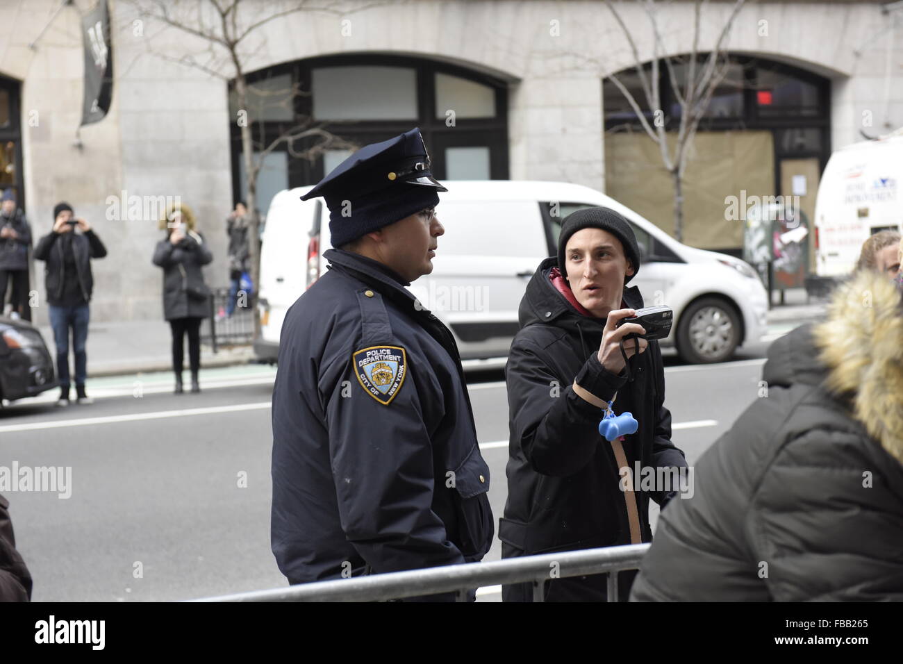 New York City, United States. 12th Jan, 2016. NYPD try to keep sidewalk ...