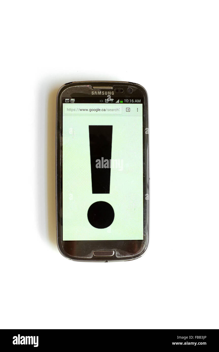 An exclamation mark on a smartphone screen photographed against a white