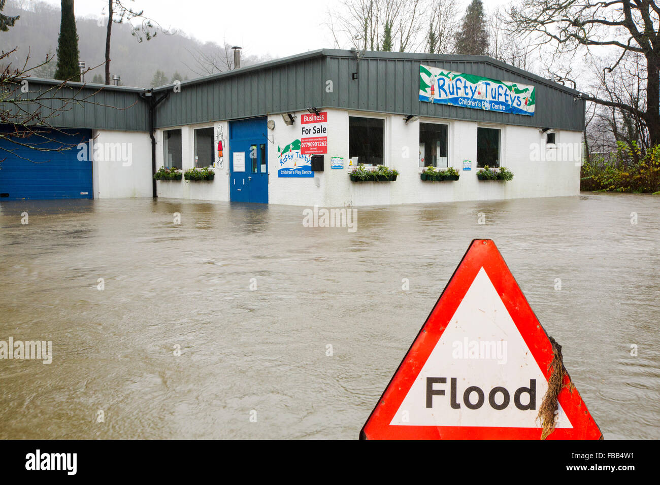 A childrens play centre surrounded by flood waters by the banks of the River Rothay in Ambleside, in the Lake District on Saturday 5th December 2015, during torrential rain from storm Desmond. Stock Photo