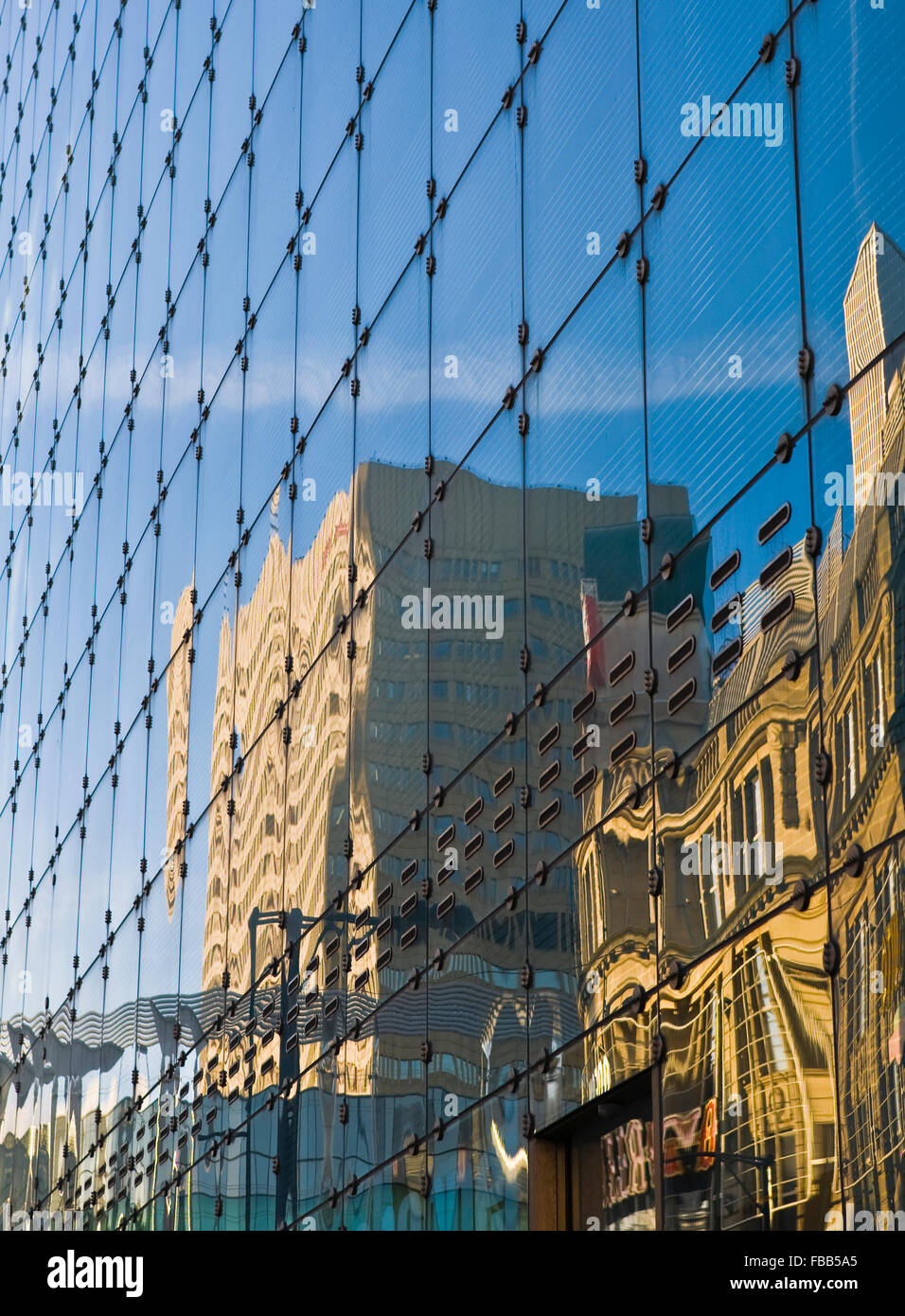 Manchester sky line reflection in modern glass building Stock Photo