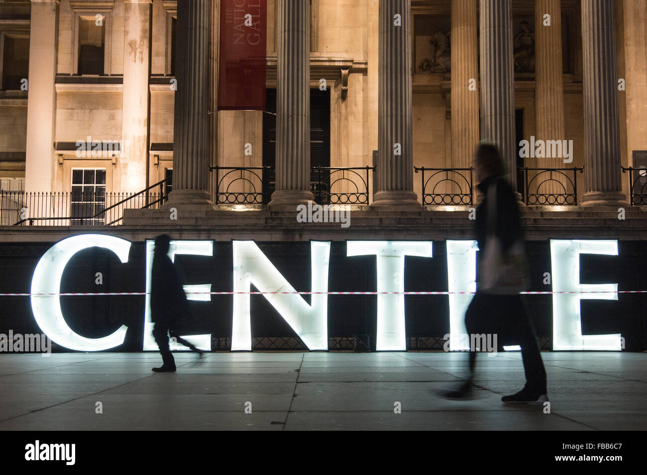 London, UK. 13 January 2016. The giant neon letters from the Centrepoint building are lit up in Trafalgar Square. Developed by creative producers Artichoke and supported by the Mayor of London, Lumiere London runs from 14th-17th January 2016, 6.30-10.30pm. Free to attend, the festival will re-imagine London’s urban landscape and architecture in 30 artworks across four main areas: King’s Cross; Mayfair and Grosvenor Square; Piccadilly, Regent Street, Leicester Square and St James’s; and Trafalgar Square and Westminster. Credit:  Nick Savage/Alamy Live News Stock Photo