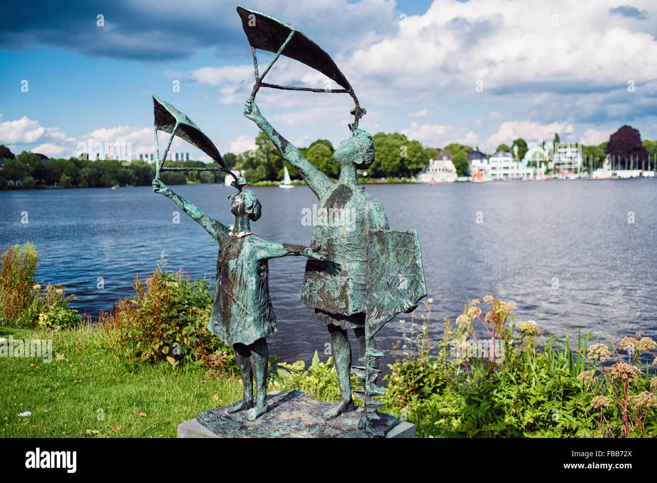 Sculpture of Two Children with Kites along Alster Lake, Hamburg, Germany Stock Photo