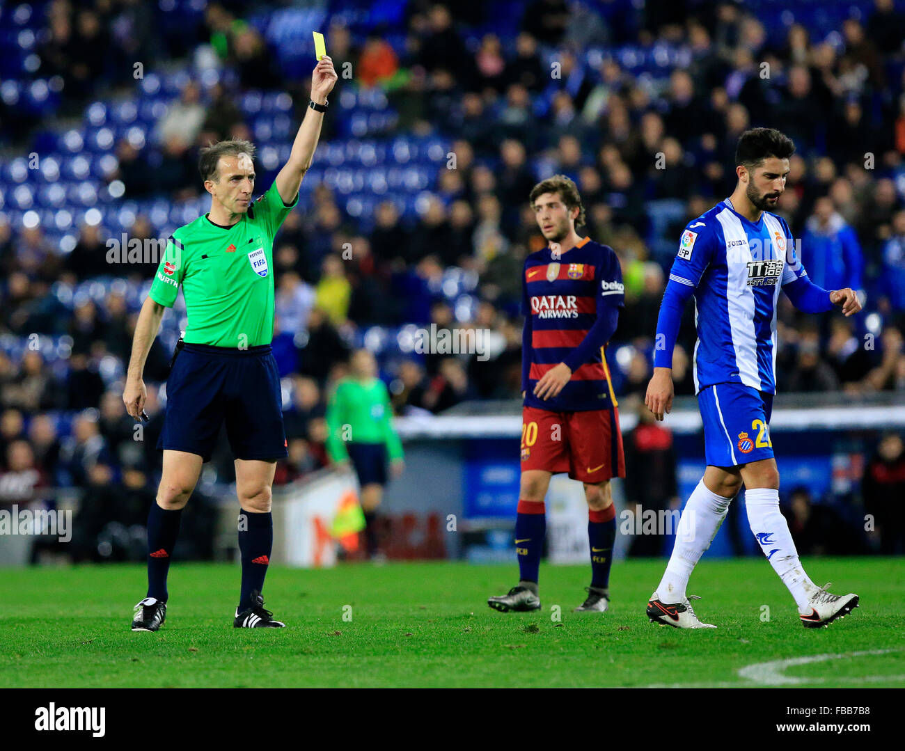 Barcelona, Spain. 13th Jan, 2016. Referee shows a yellow card to RCD Espanyol's Spanish defender Alvaro Gonzalez during the second round of Spanish King's Cup eighth final match against FC Barcelona at the Cornella-El Prat stadium in Barcelona, Spain, on Jan. 13, 2016. FC Barcelona won 2-0. © Pau Barrena/Xinhua/Alamy Live News Stock Photo