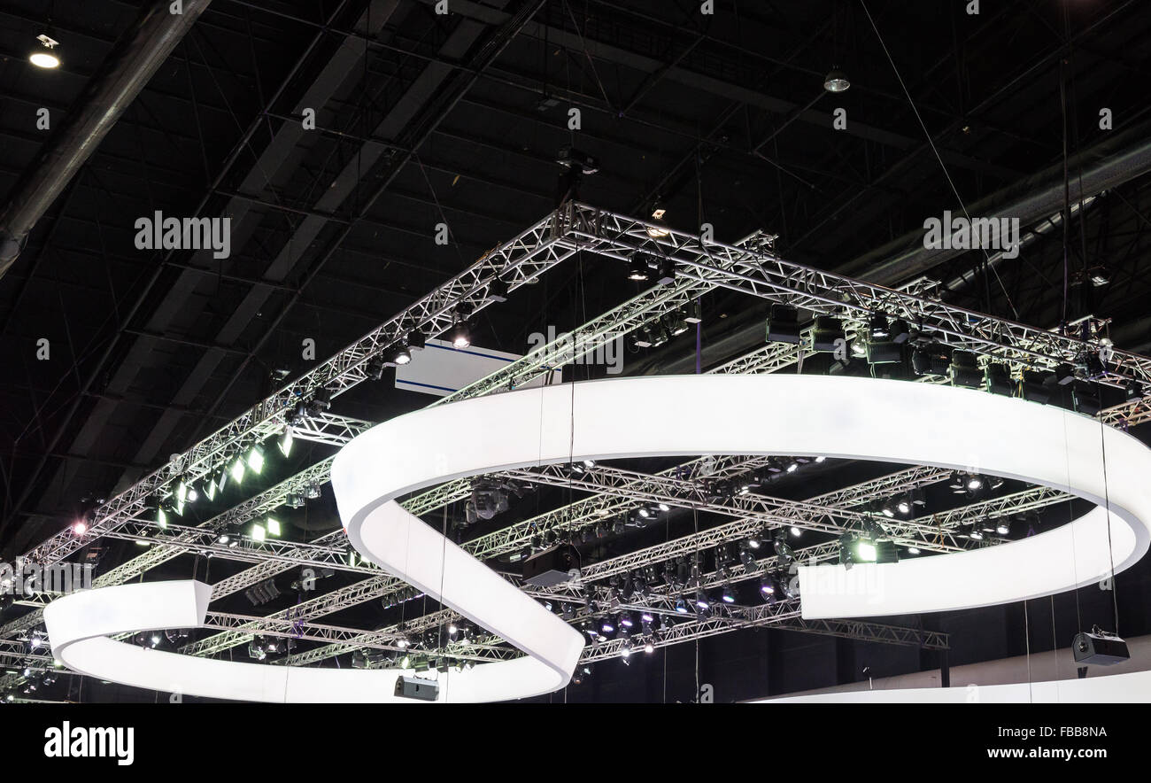 Modern light curve on the ceiling of exhibition hall. Stock Photo