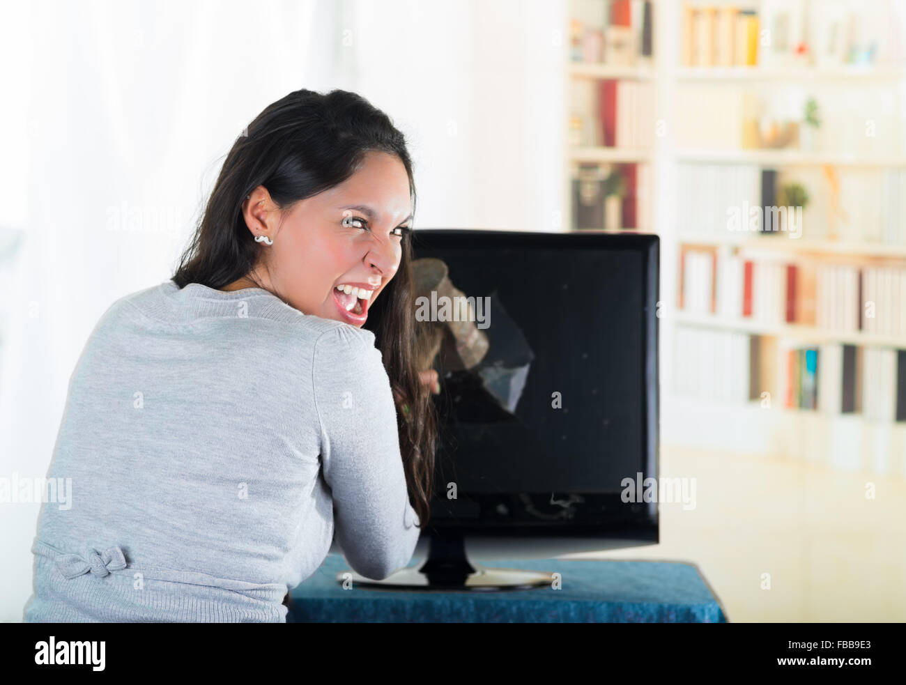 Woman smashing laptop hammer hi-res stock photography and images - Alamy