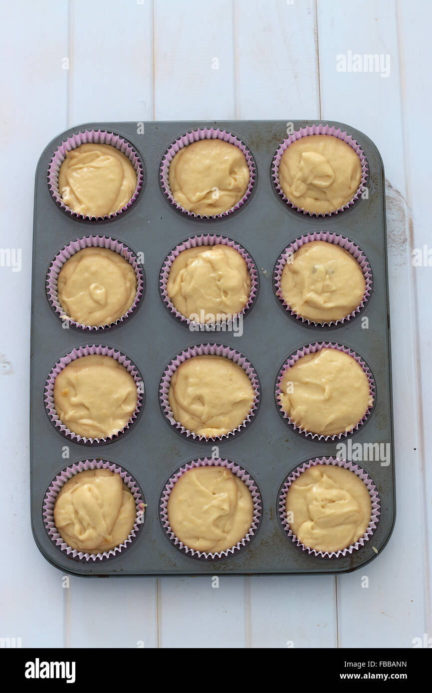 Uncooked cupcakes in cupcake tin Stock Photo Alamy