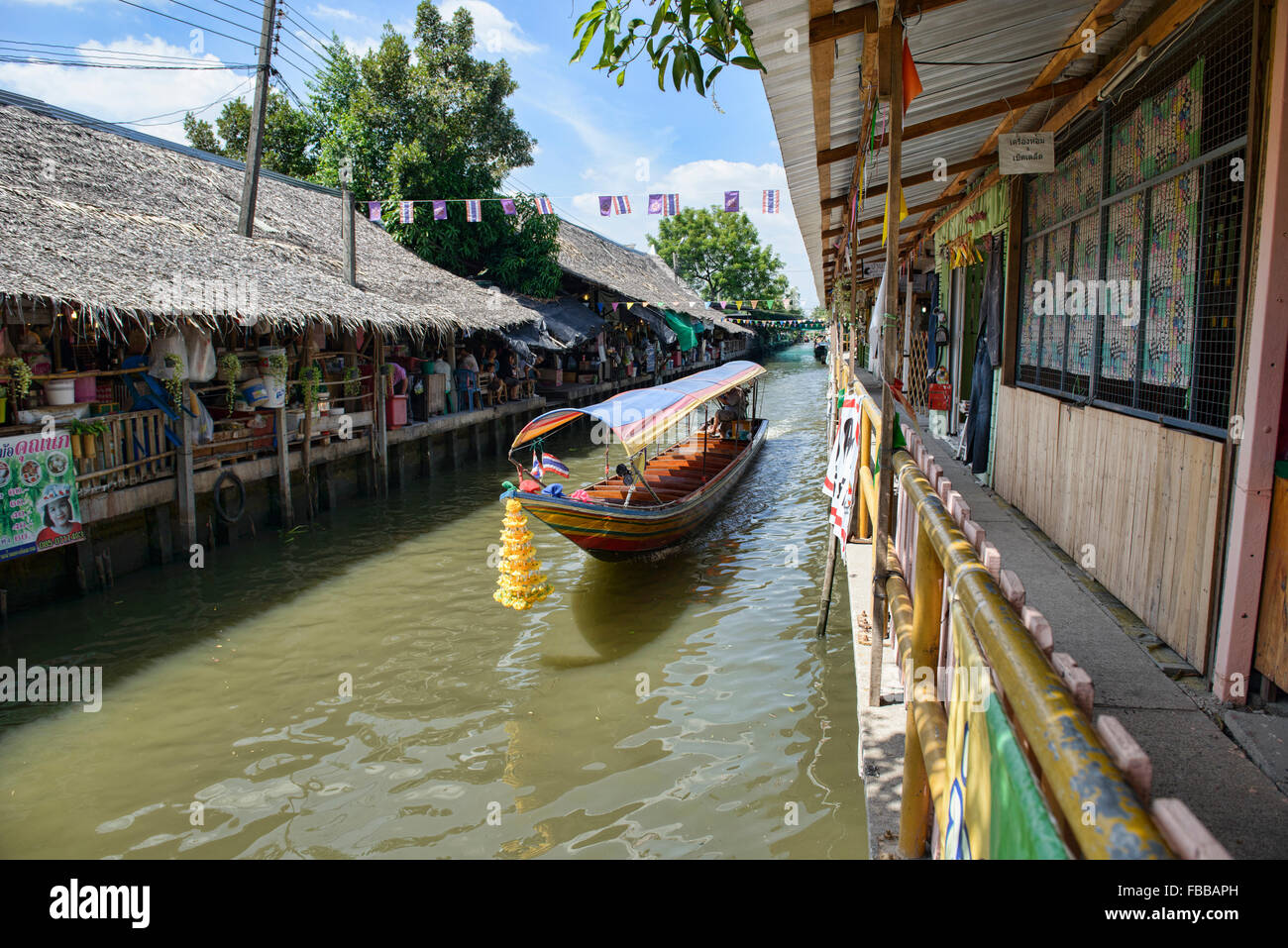 Longtail boat on the Thonburi Canal in Bangkok, Thailand Stock Photo