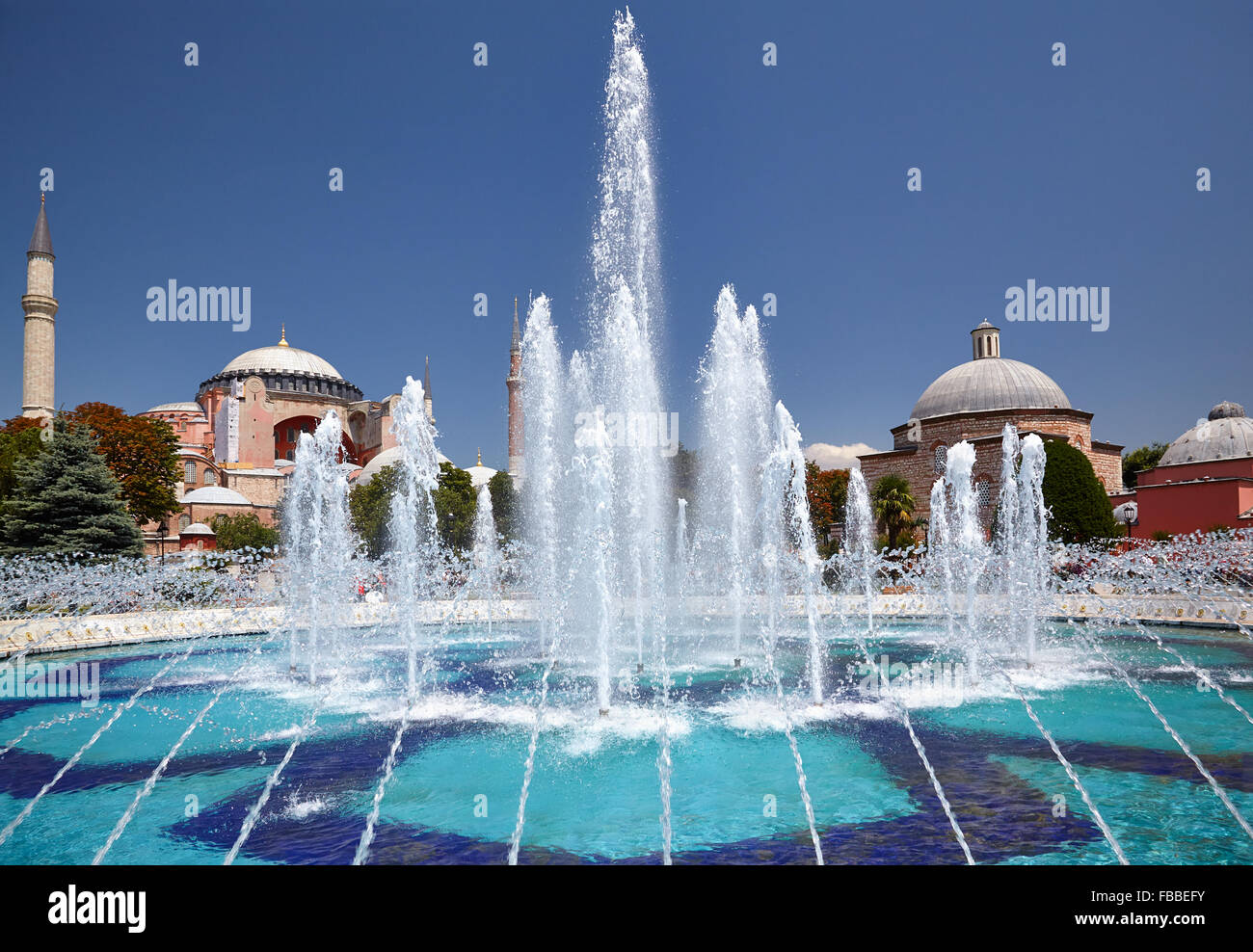 The view of fountain in Sultan Ahmet Park with Hagia Sophia on the left ...