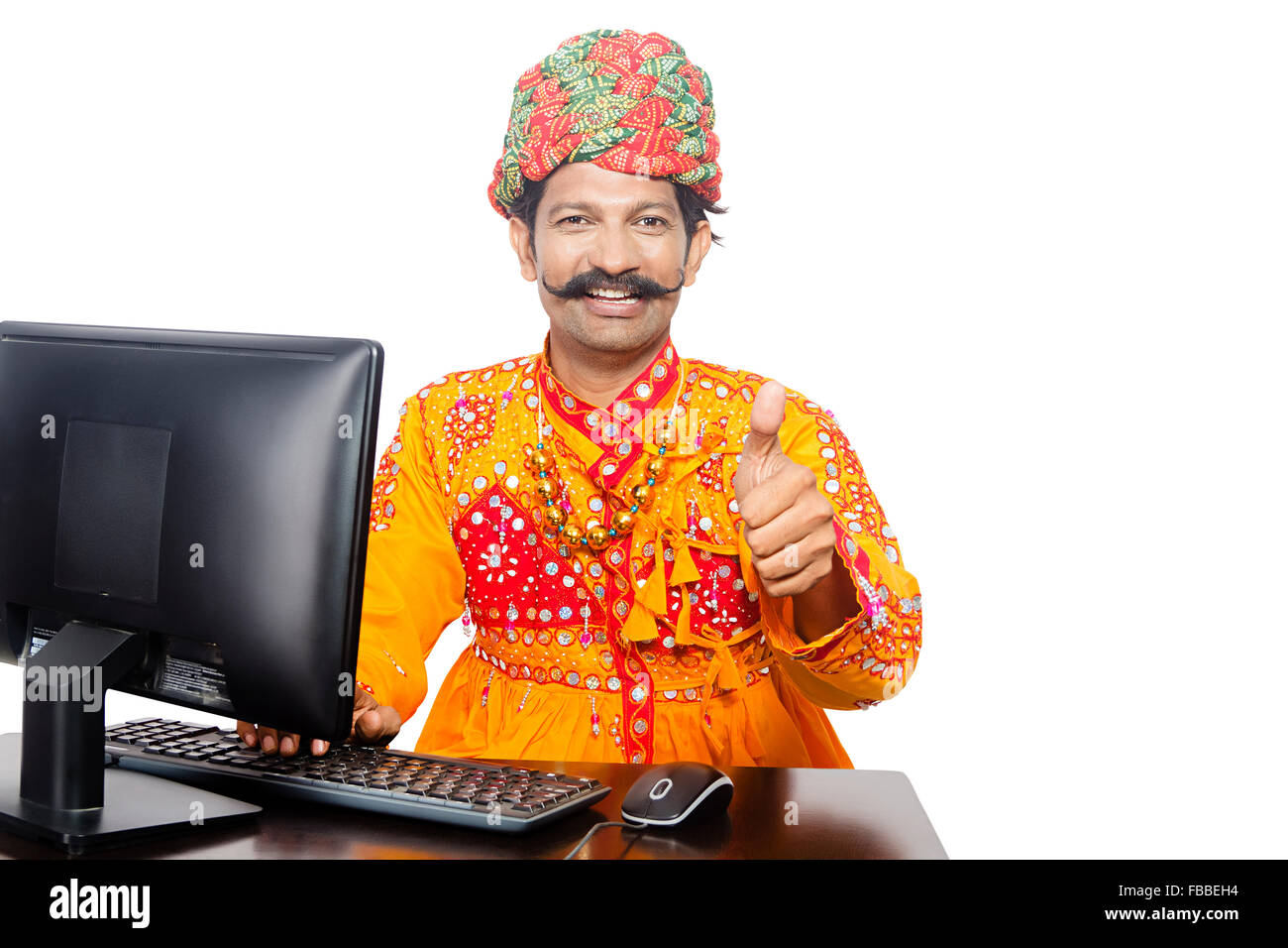 1 indian Rural Gujrati man Computer Education and Thumbs Up showing