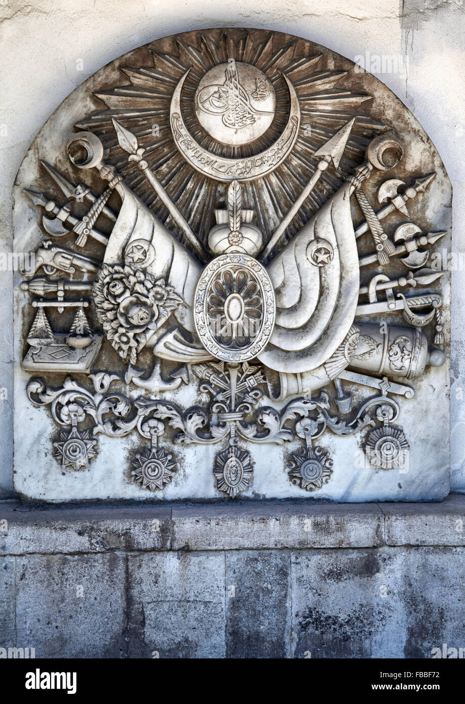 ISTANBUL, TURKEY - JULY 12, 2014: Coat of arms of the Ottoman Empire bas-relief on the wall on the territory of Topkapi Palace, Stock Photo