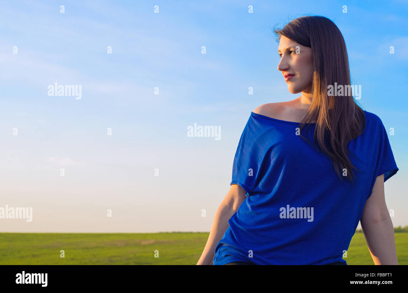 Portrait of a beautiful young woman in the summer on the nature Stock ...