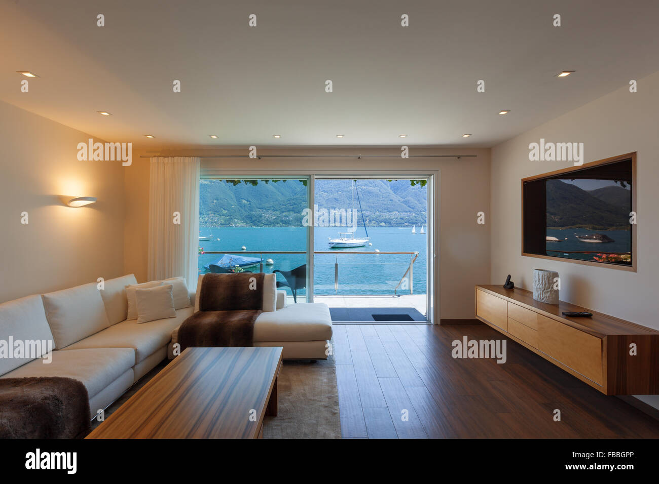 Interior architecture, modern living room with lake view Stock Photo ...