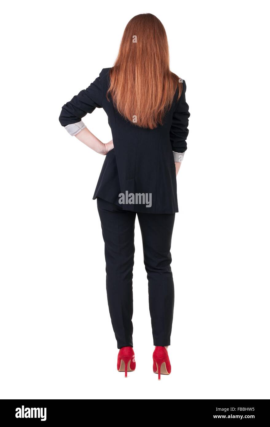 Beautiful young business woman looking at wall.Rear view. Isolated over ...