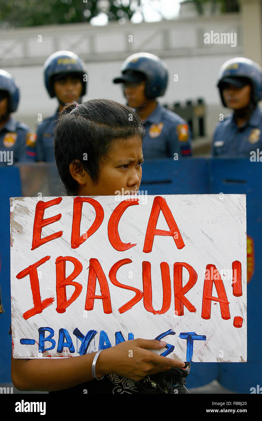Manila, Philippines. 14th Jan, 2016. An activist holds a placard during a protest rally in front of the U.S. Embassy in Manila, the Philippines, Jan. 14, 2016. The activists are calling for an end to the Enhanced Defense Cooperation Agreement (EDCA) after the Philippine Supreme Court decided that the Philippines' defense cooperation deal with the United States is constitutional and does not need the concurrence of the Senate. Credit:  Rouelle Umali/Xinhua/Alamy Live News Stock Photo