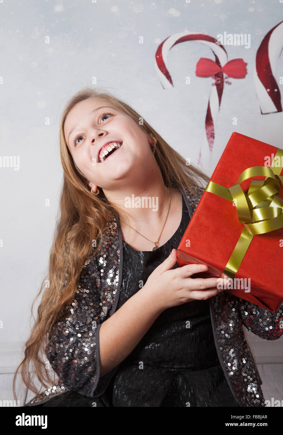 Portrait of a 10 year old girl, Christmas themed portrait, studio shot. Stock Photo