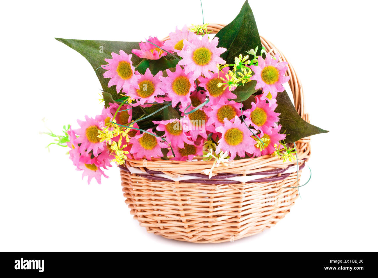 Pink fabric flowers in wicker basket isolated on white background Stock ...
