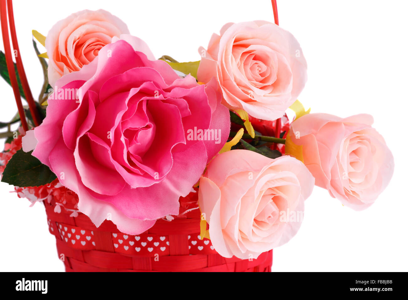 Pink fabric roses in wicker basket isolated on white background Stock ...