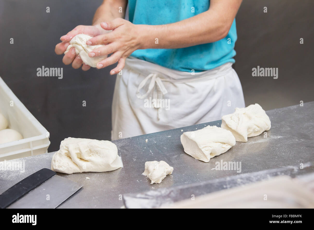 man cook dough restaurant kitchen Stock Photo