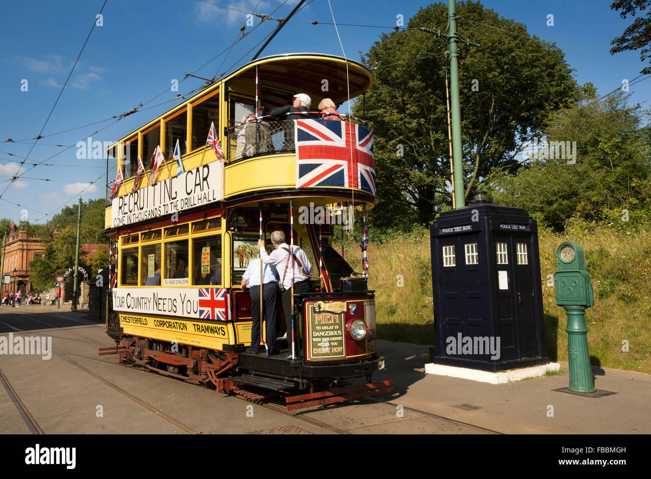 UK, England, Derbyshire, Crich, Tramway Museum, Chesterfield Tram no 7 in WW1 Recruitment guise, passing police call box Stock Photo