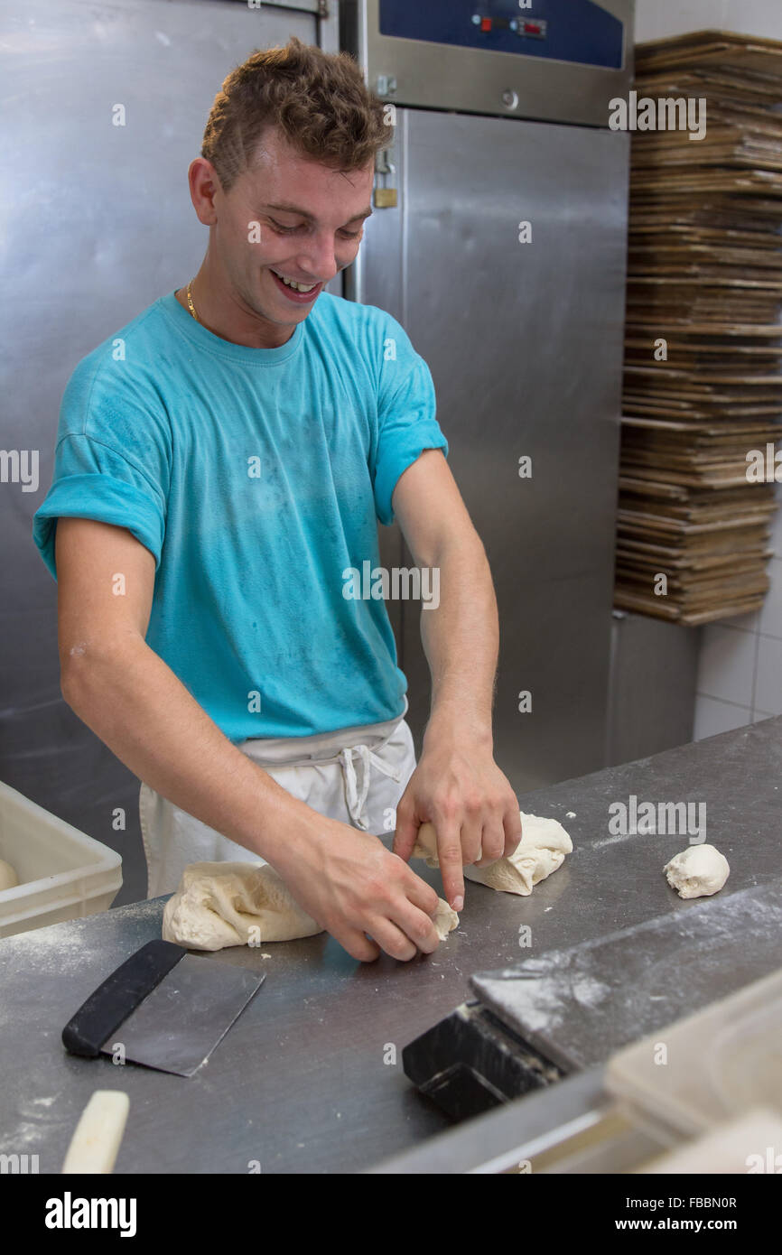 cook dough cooking commercial kitchen restaurant inside Stock Photo