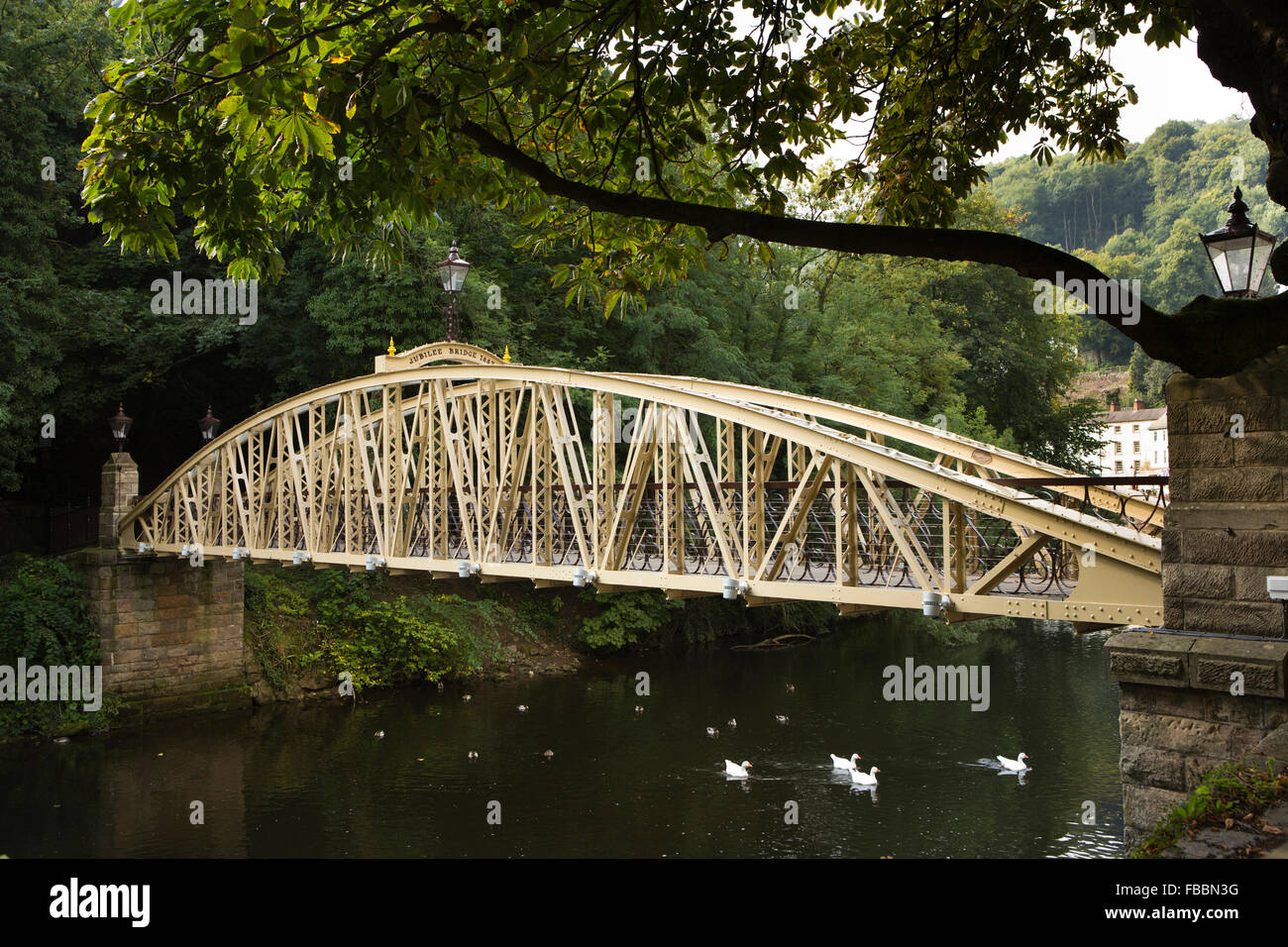 UK, England, Derbyshire, Matlock Bath, 1897 Jubilee Bridge across River Derwent to riverside Lover’s Walk Stock Photo