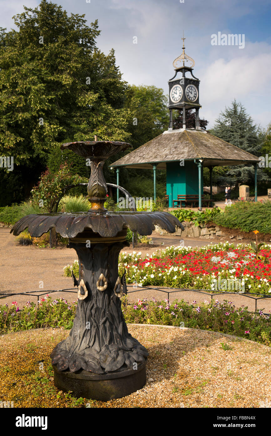UK, England, Derbyshire, Matlock, Hall Leys Park, cast iron fountain amongst Old Tram Shelter floral beds Stock Photo