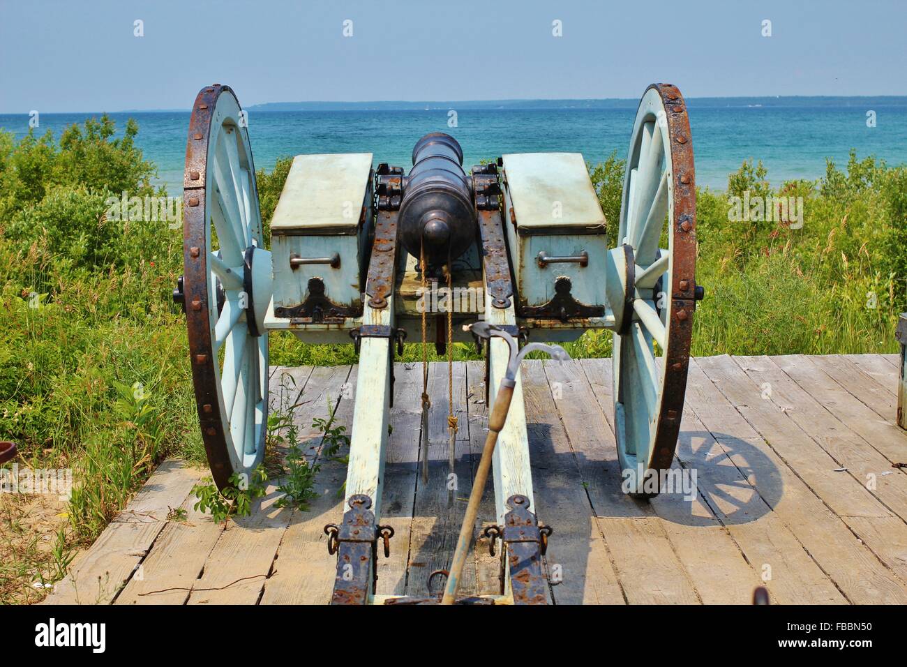 Cannon on the shores of Lake Michigan at historic Fort Michilimackinaw in Mackinaw City, Michigan. Stock Photo