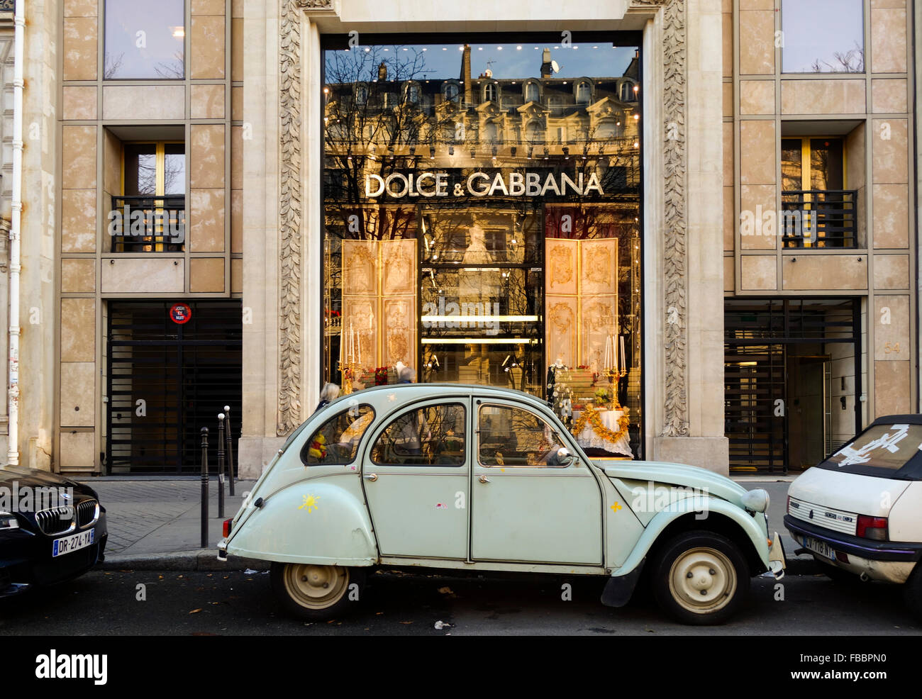 Luxury Dolce & Gabbana, fashion house entrance, with Citroën 2CV parked in  front, Paris, France Stock Photo - Alamy