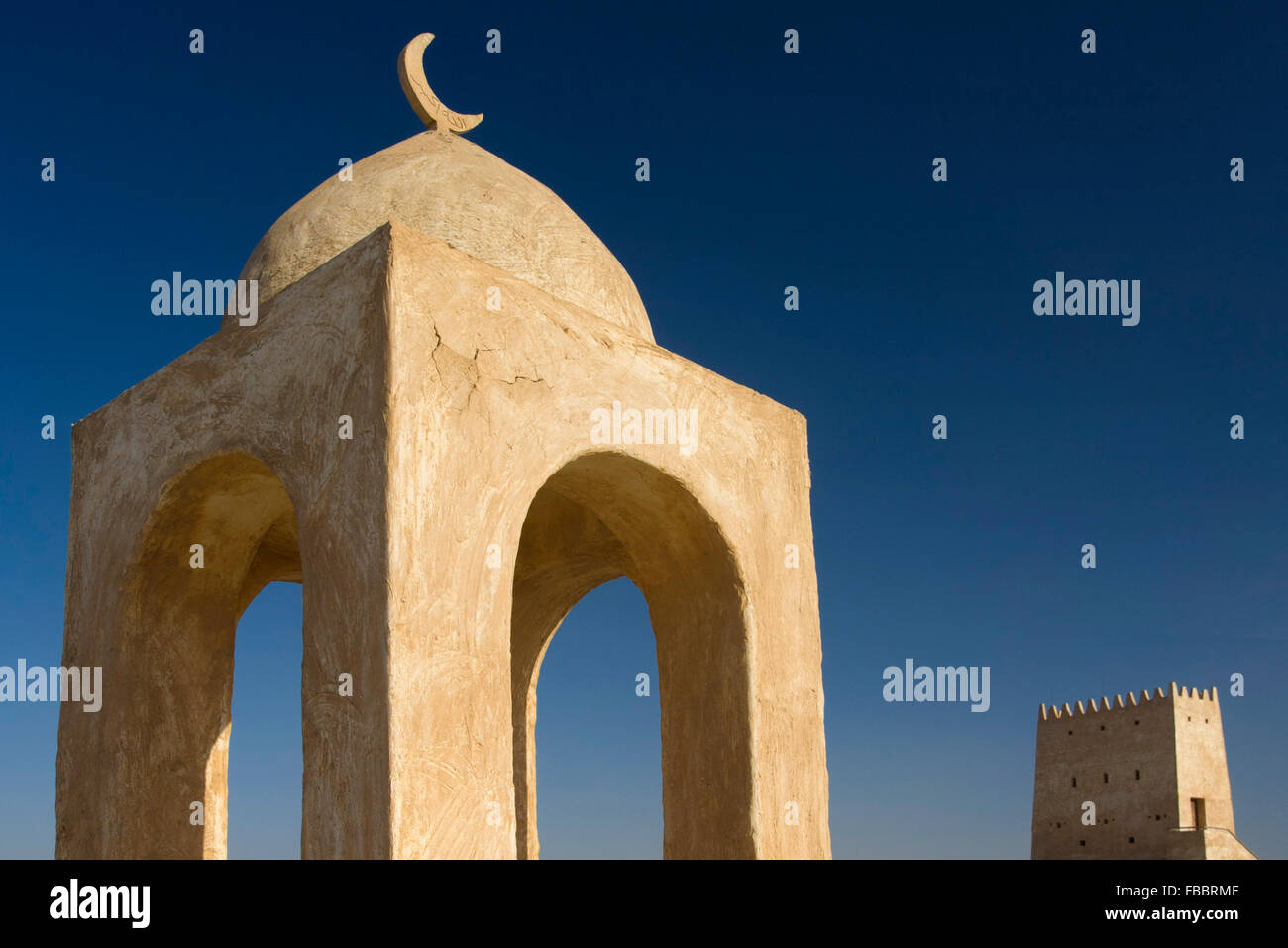Barzan Towers  Umm Salal Mohammed Fort Towers, watchtowers in Doha Qatar with mosque architecture and crescent moon Stock Photo