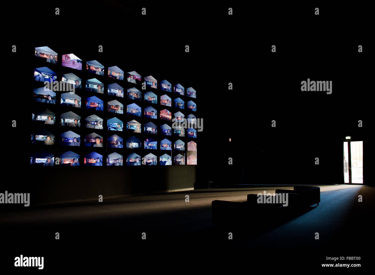 The multimedia installation 'Die Provinz des Menschen/The Human Province' by the composer and director Heiner Goebbels can be seen in the Kunsthalle im Lipsiusbau in Dresden, Germany, 14 January 2016. The installation is made up of 54 different film sequences, played on a giant wall of monitors, together forming a composition that explores polyphony both as a musical and visual phenomenon and that presents an urban soundscape of various cities, criss-crossed by actor André Wilms. Visitors watch the same man observing the same rituals over the course of ten years, between 2004 and 2014, pacin Stock Photo
