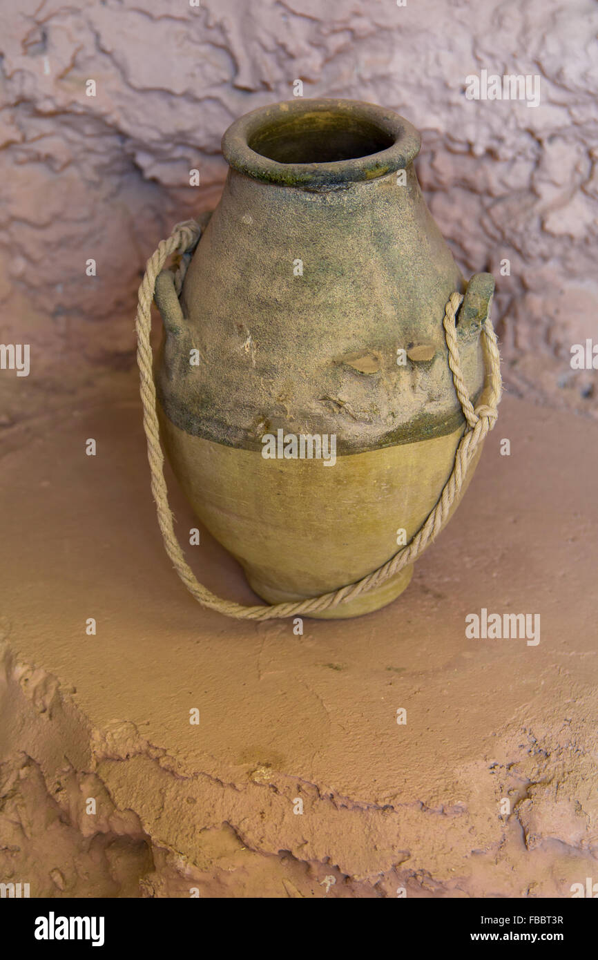 Traditional arabic clay jar over mud water well Stock Photo Alamy
