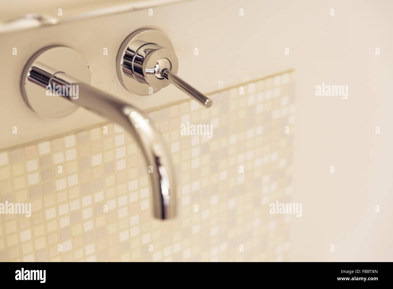 Detail of chrome faucet, selective focus Stock Photo