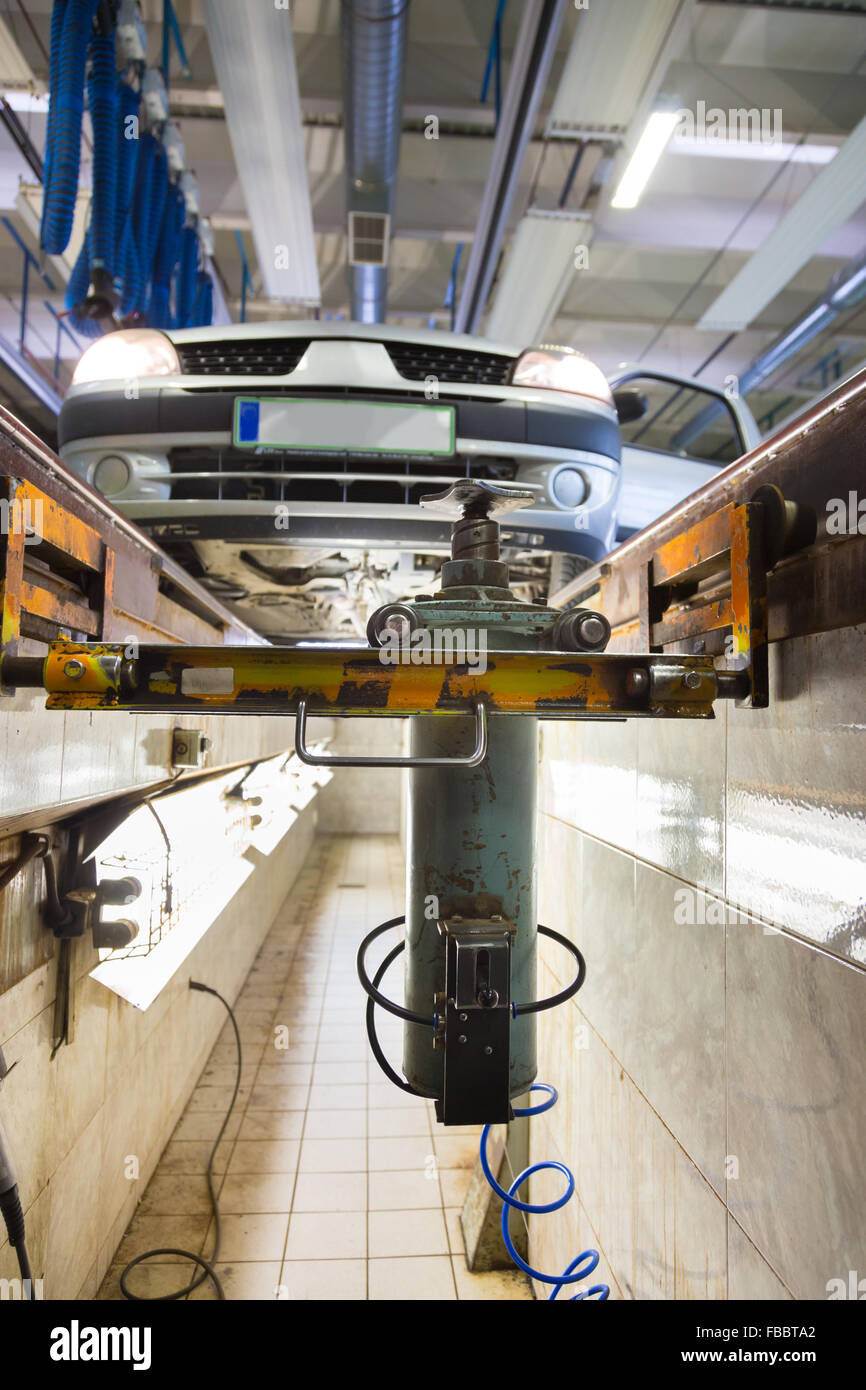 Car on service platform in garage Stock Photo Alamy