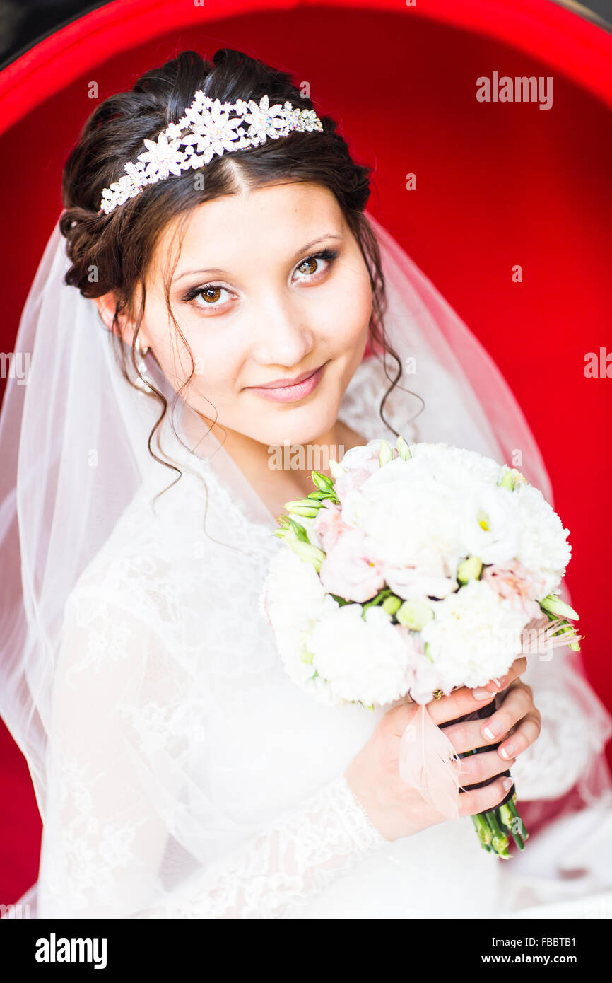 Wedding. Beautiful bride with bouquet Stock Photo - Alamy