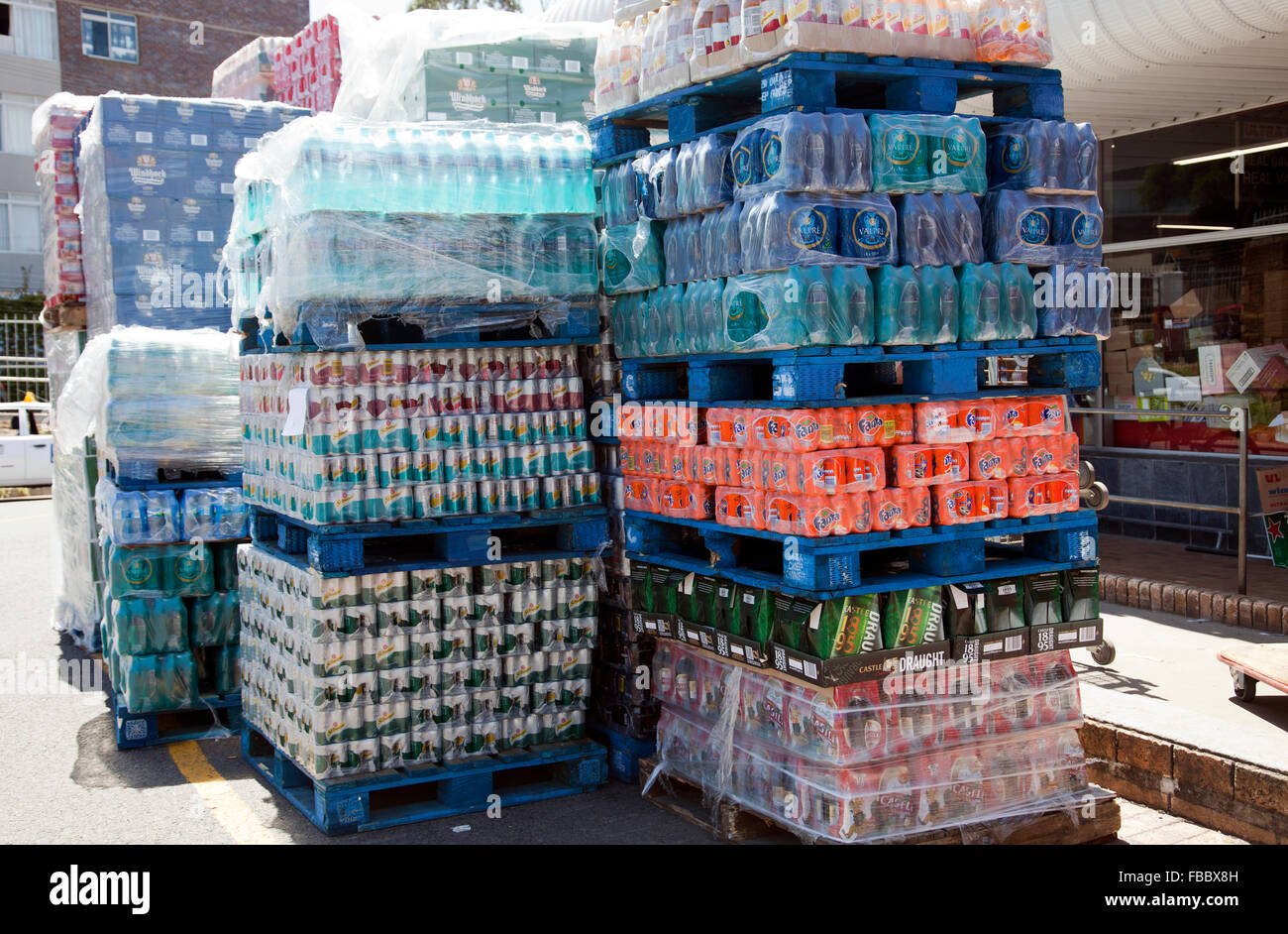 Stacked Delivery of Mixed Soft Drinks and Beers outside Liquor Store in