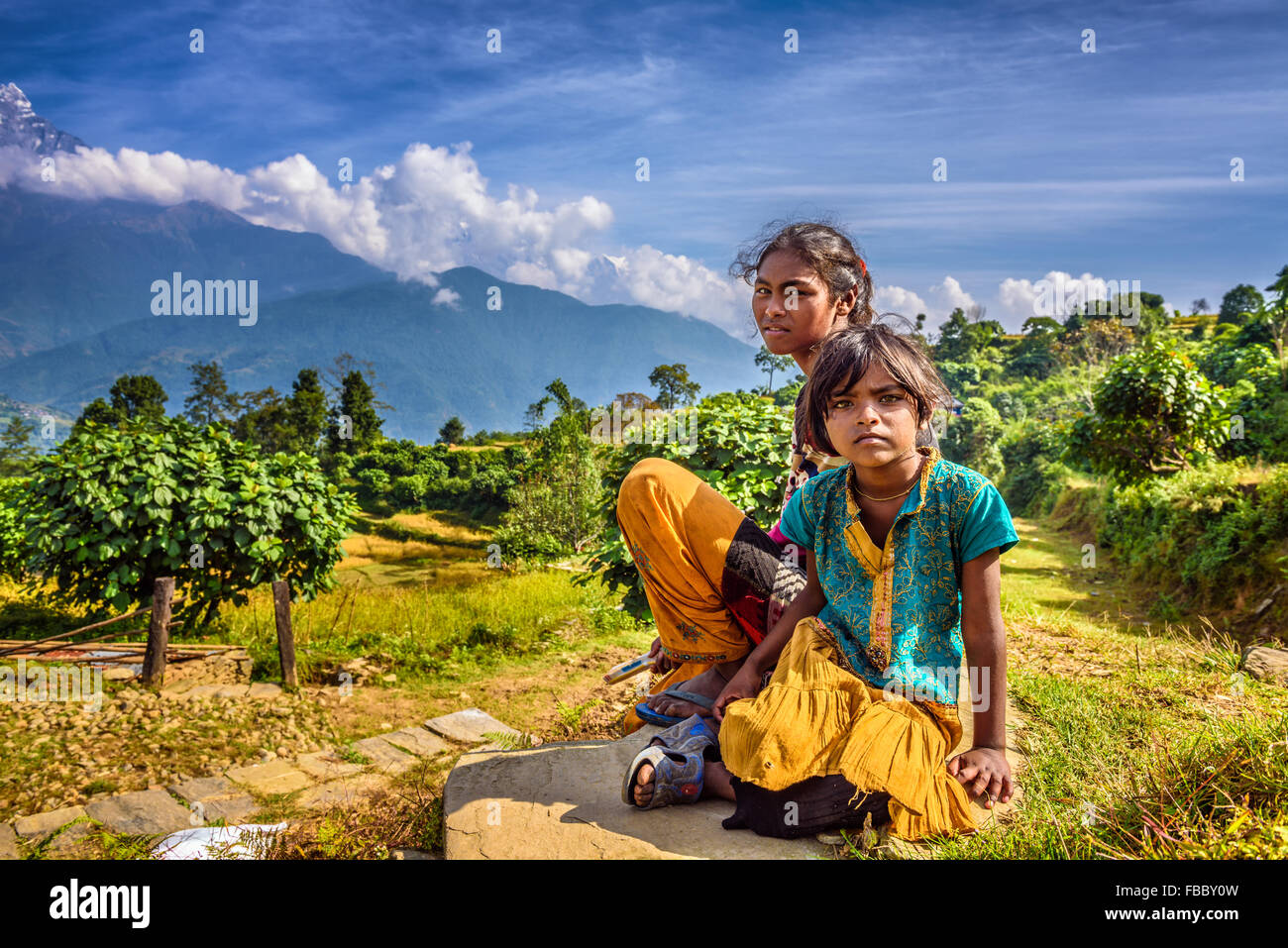 Nepalese children play in the Himalayas mountains near Pokhara Stock Photo