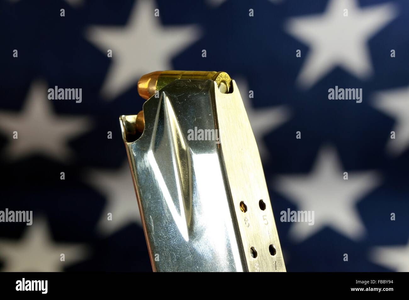 Bullets with gun clip on United States Flag Stock Photo