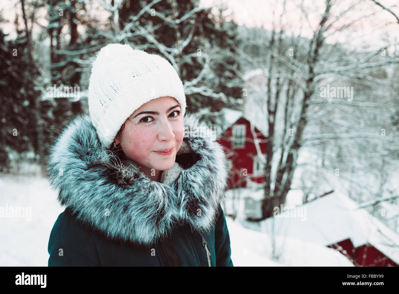 Beautiful young woman in the winter forest Stock Photo - Alamy