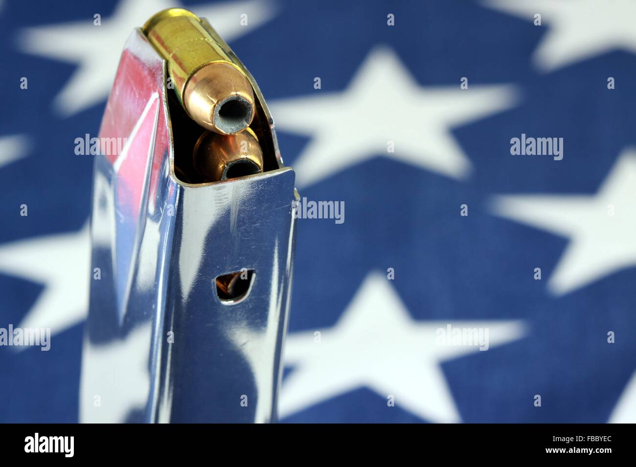 Bullets with gun clip on United States Flag Stock Photo Alamy