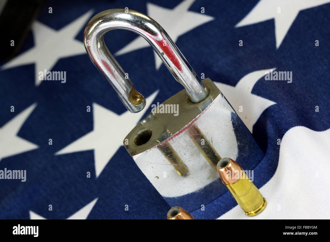 Ammunition and padlock on United States flag - Gun rights and gun control concept Stock Photo