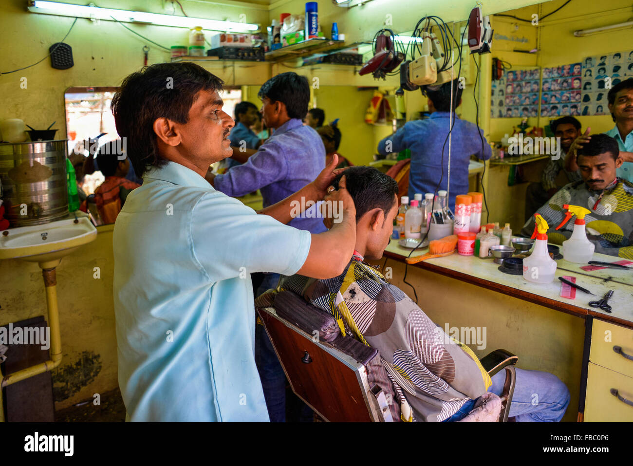 India Mumbai Bombay Macchimar Nagar Fishing Village  Barber’s shop Stock Photo