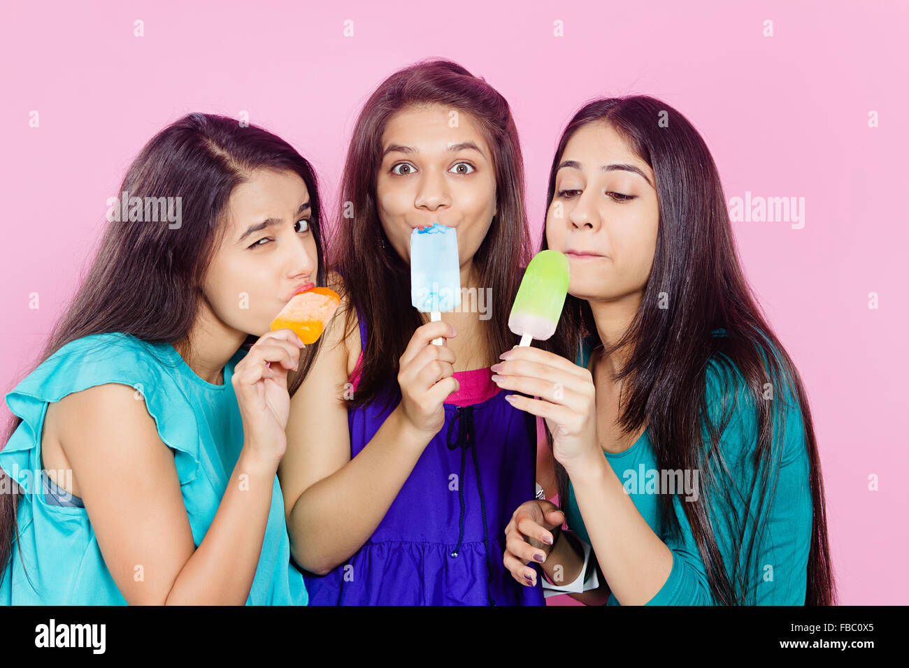 3 indian Young Womans friends  Eating Ice Cream Stock Photo